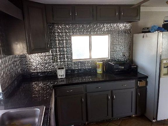 new counter tops with tin back splash