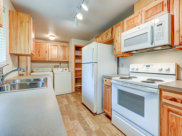 Updated Kitchen. With ExLarge Pantry, Door to Back yard and tons of storage.
