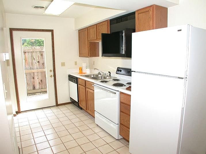 Kitchen Area with Dishwasher Stove and Refrigerator