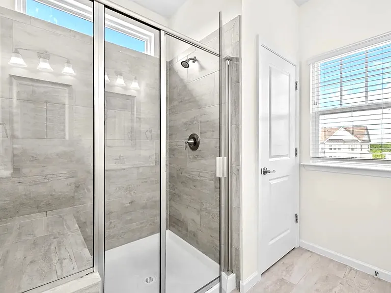 Tile shower with seat, separate linen closet