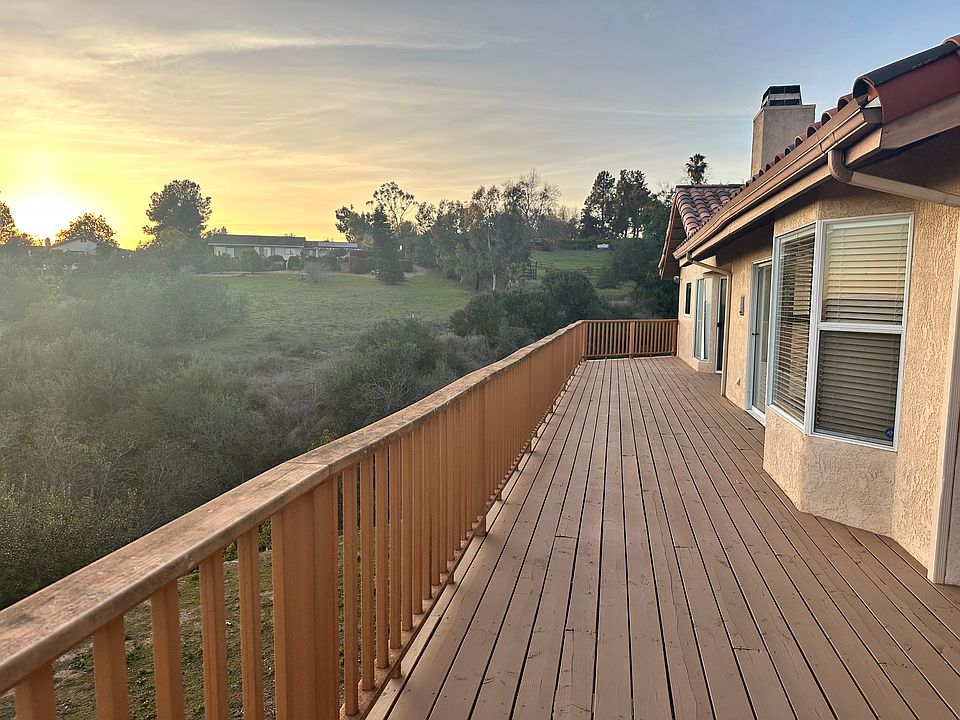 Deck with access from dining room, family room, and primary suite