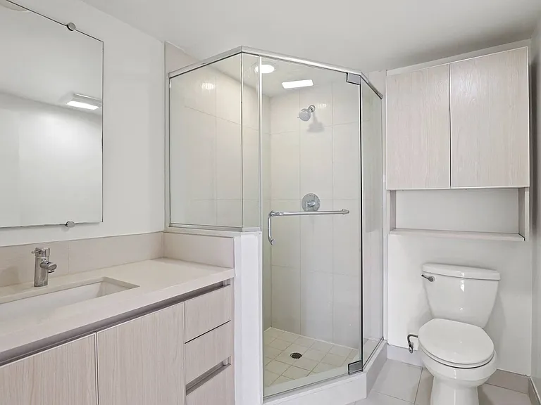 Bathroom with a Stand-Up Shower and Extra Cabinet Storage