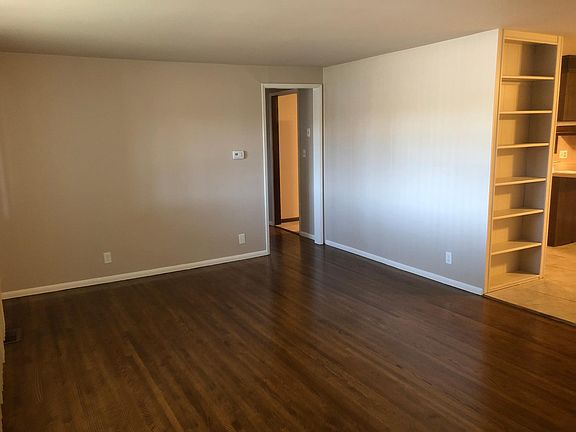 Living room to dining room with built in bookcase