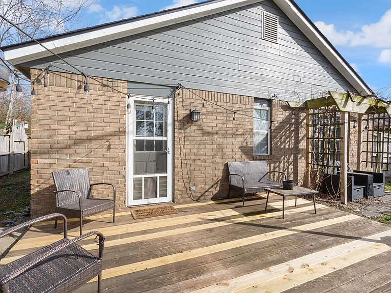 Backyard has a deck area and side yards. Backdoor has a small-medium dog door.