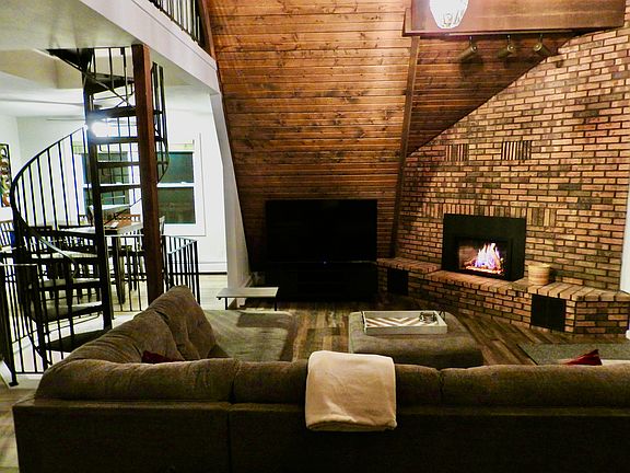 Main level living room. Opens onto a large deck.