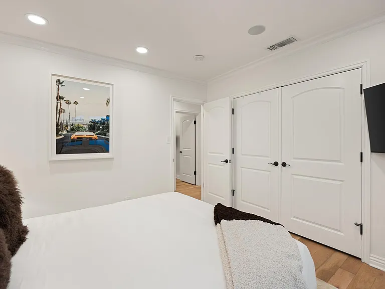 Discover modern elegance in Bedroom 3, where a Queen Size bed and a large Smart TV come together to create a stylish and restful space.