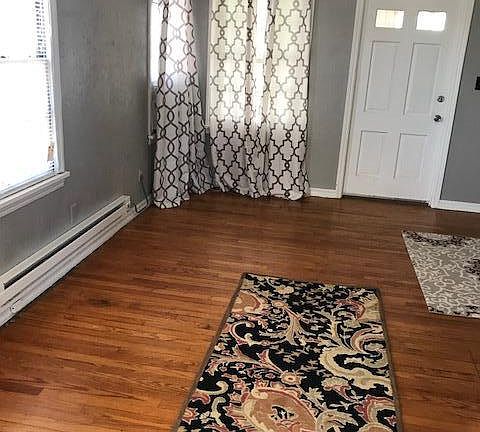 kitchen to living room view. Front door
