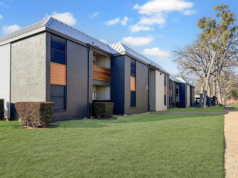 A welcoming community design with modern architecture and lush landscaping.
