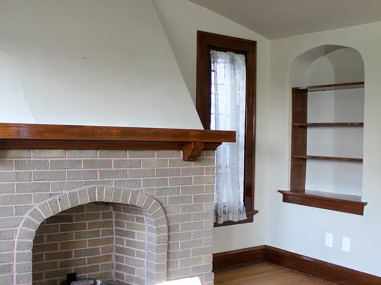 Living room built in shelves, electric fireplace.