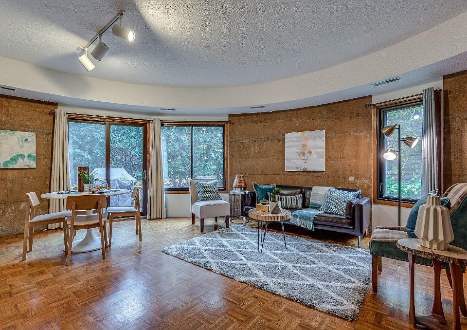 First floor condo with aggregate walls and private patio.
