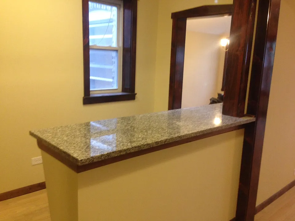 Hallway view from kitchen pantry. Granite counter top