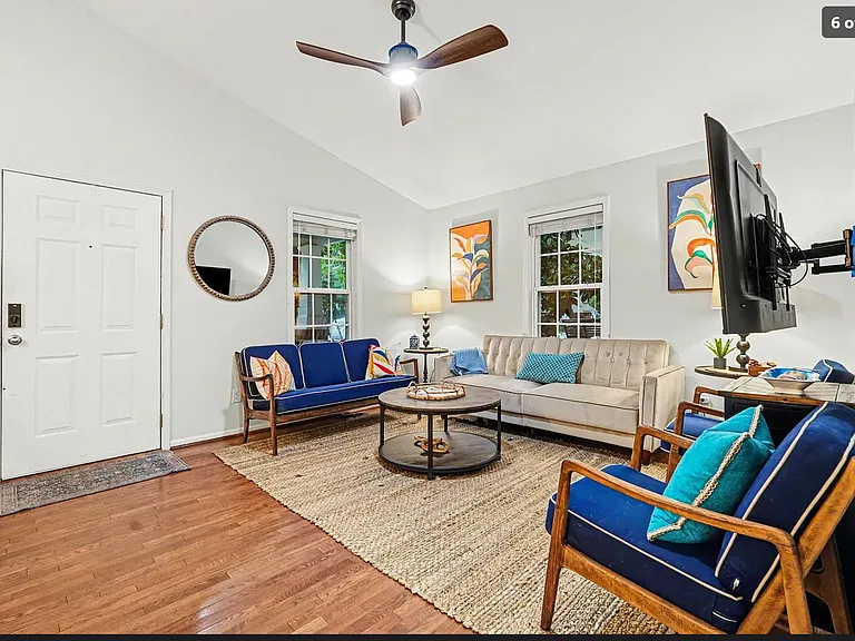 Living area to the left as you enter.

 Note: Furnishings are not included and are from the listing photos.