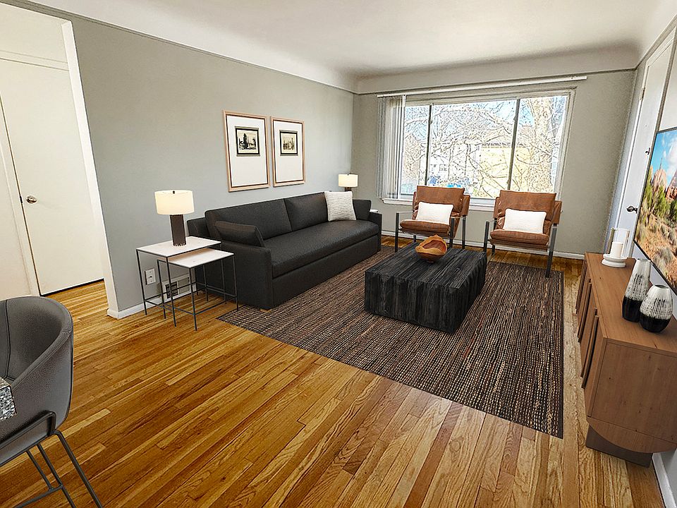 From newly updated wood plank flooring to sleek grey kitchen cabinetry, all is cool inside.