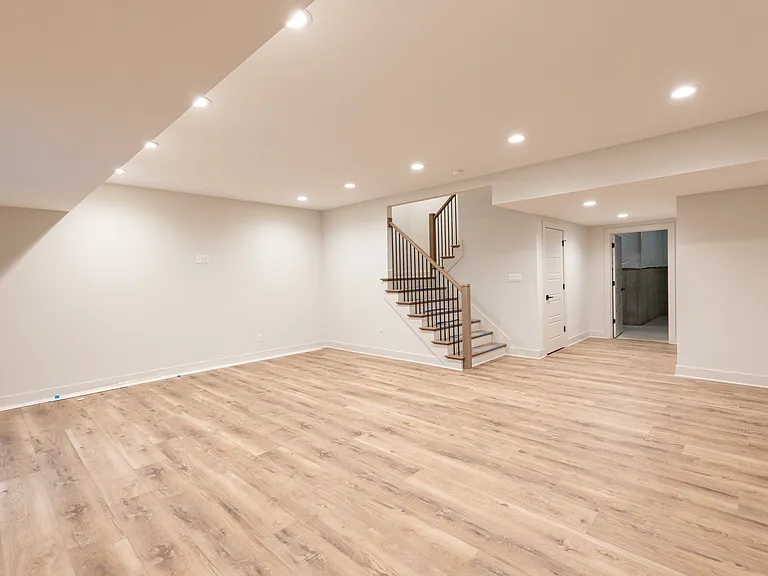 Family room. Basement. Hallway to storage. Stairs to main floor.