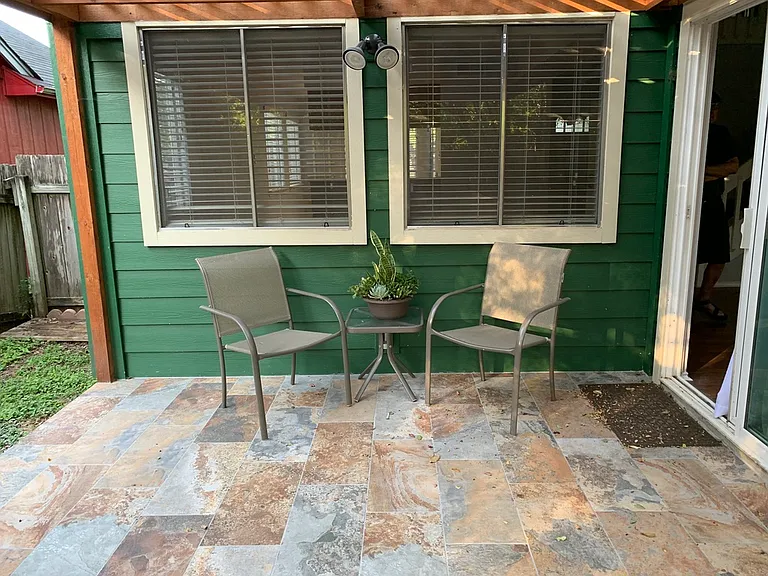 Outdoor patio daytime. Beautiful wood pergola over the patio.