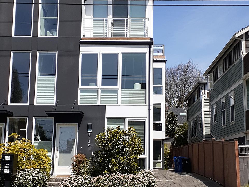 Front-facing view of the townhouse and driveway entrance