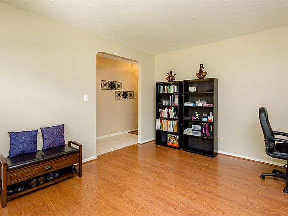 Another view of the living room looking in to the main entry of this home. This room is spacious and flexible and could be used as a living room/sitting area, playroom or gameroom. You decide how it would best fit your life style.