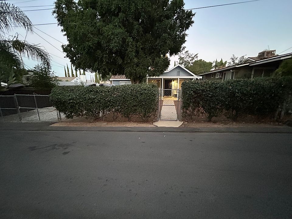 Street view of property with lockable walk through and drive through gates