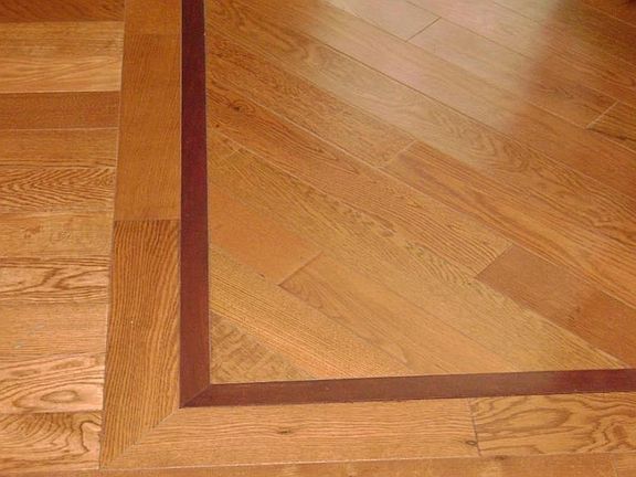 Inlaid wood floor in dining room.