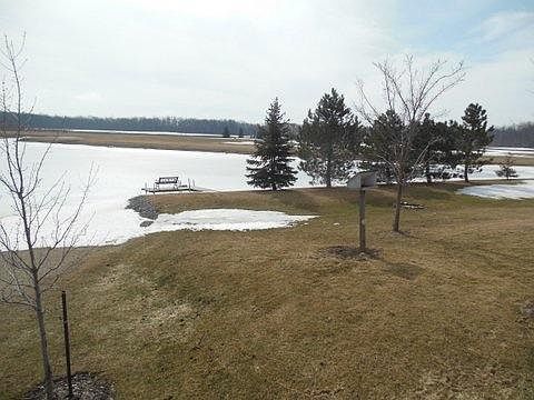 Large pond with sand area