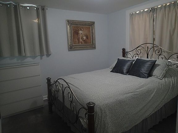 Bedroom with brand new Queen mattress, all new linens