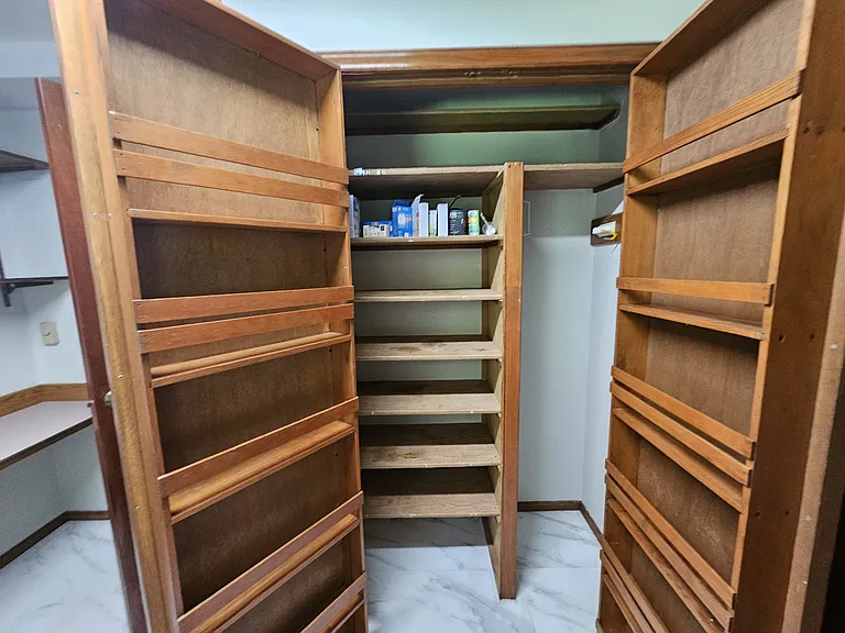 Even more storage in the closet with custom built-ins to keep everything organized.