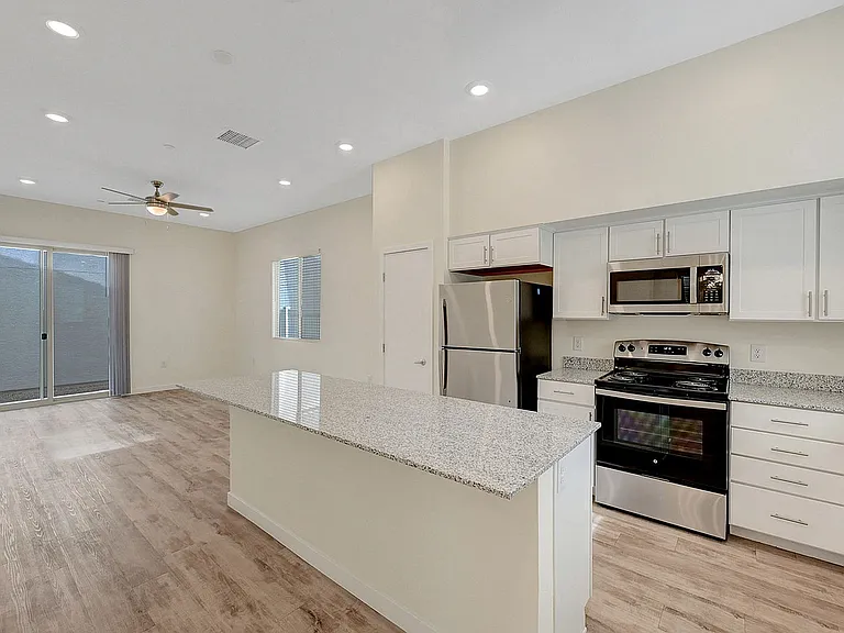 Experience the elegance and functionality of this beautifully designed open-plan kitchen and living area.