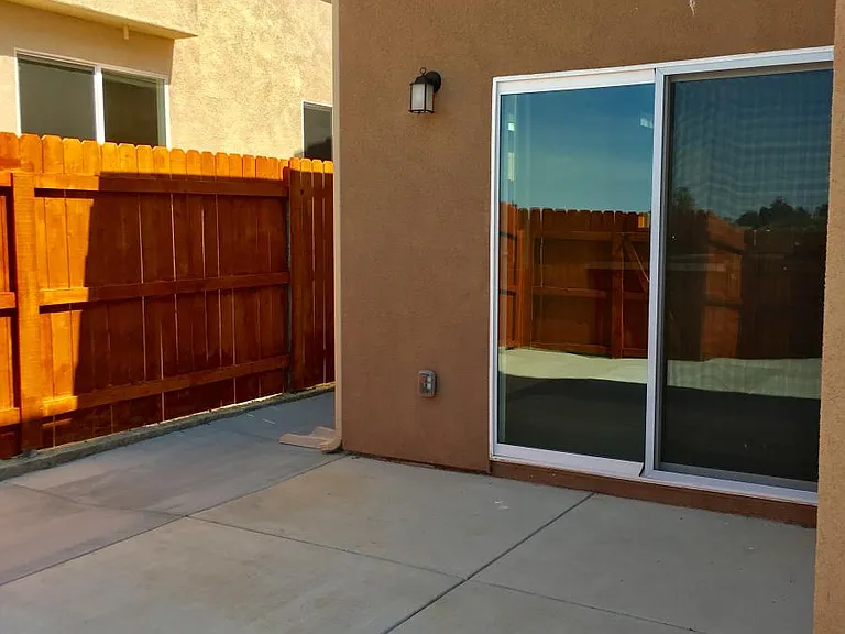 Concrete patio is accessible from the dining area.
