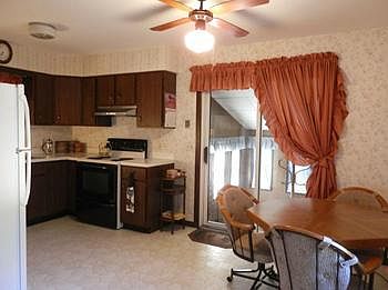 Doors in kitchen leading to nice sunroom