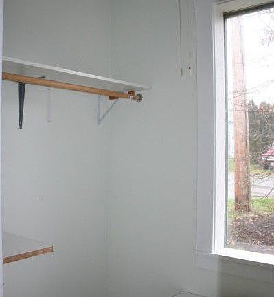 Walk in closet in the master has it's own huge window for loads of natural light and lots of storage