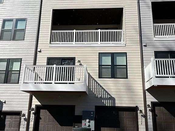 Back of condo. Larger patio above.
