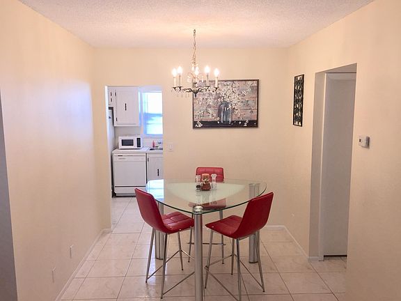 Dining room, kitchen, entrance of guess bath.