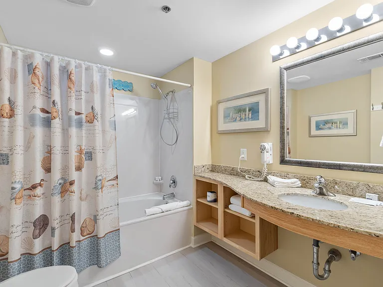 Master Ensuite with shower and tub, and a spacious bathroom vanity