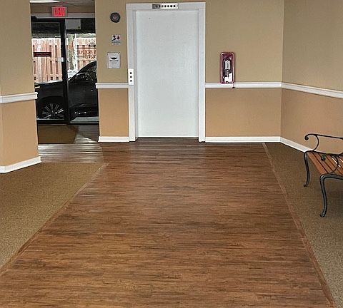 Secure lobby with video surveillance and covered parking lot with dedicated spots