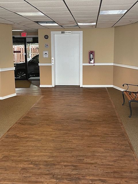 Secure lobby with video surveillance and covered parking lot with dedicated spots