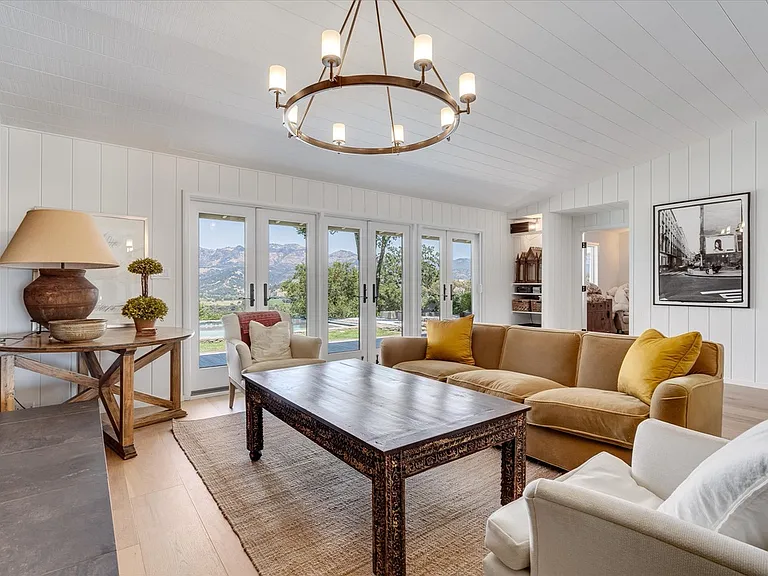 Living room with views out to pool