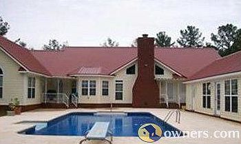 Pool is between main house and pool house