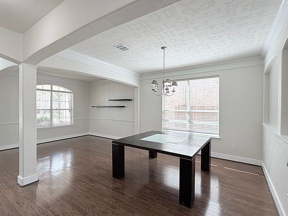 Hardwood floors and abundant natural light in your dining room.