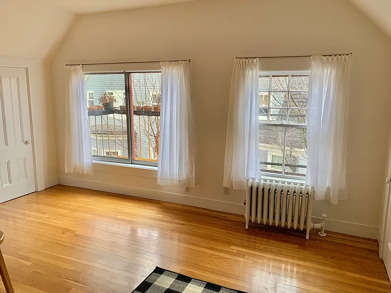 kitchen with curtains and area carpet
