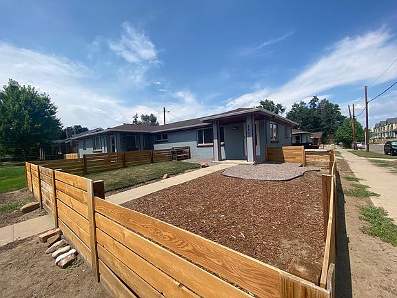 Front entrance with fenced in and gated patio.