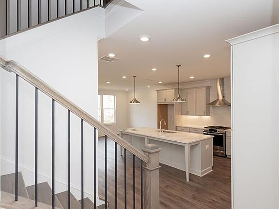 Upon entering the home, open concept, nice drop area at the front for a nice piece of furniture for