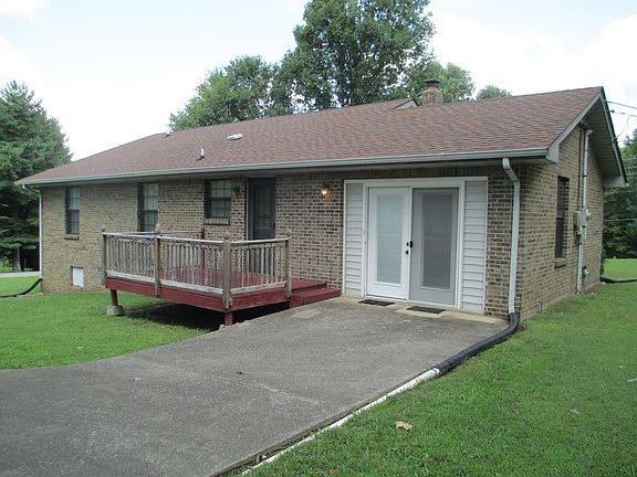 Back of house with deck