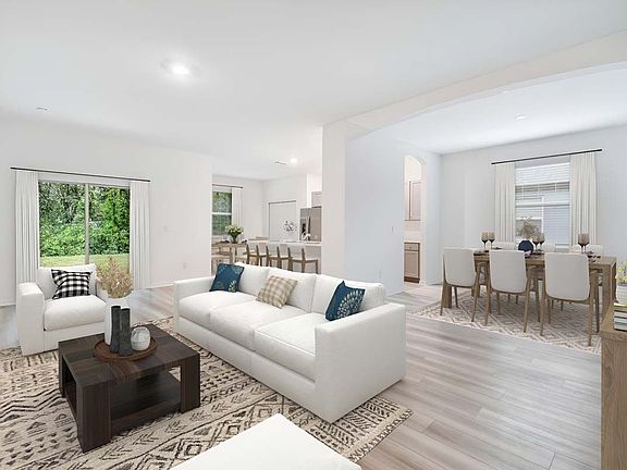 Juno new construction home plan interior open concept living great room at Lanier Acres in Zephyrhil