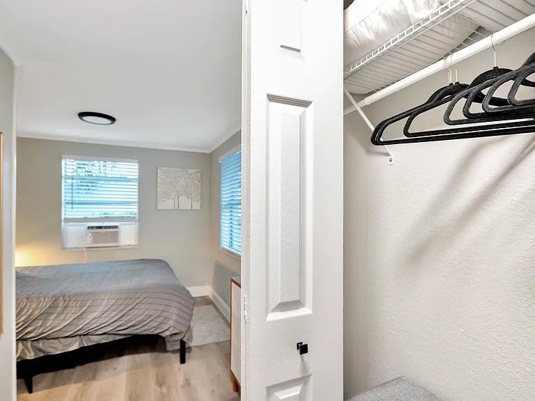 Closet has extra pillows, bedding, laundry hamper, hangers, iron, and ironing board for your additional needs and comfort.