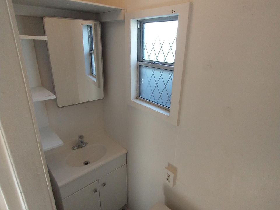 Bathroom, sink, mirror, toilet, (shower on left side, not shown in this picture)