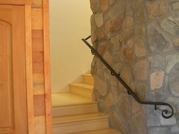Stairs round fireplace