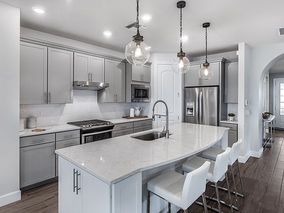 Kitchen with Stainless Steel Appliances and Quartz Countertops