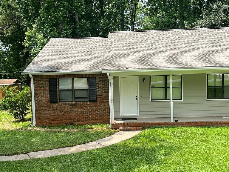 Left side of a nice duplex. Nice sitting front porch. Roof is brand new. Home is the newest on the street by decades.