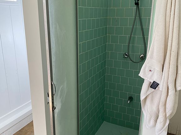 Bathroom shower, no tub.