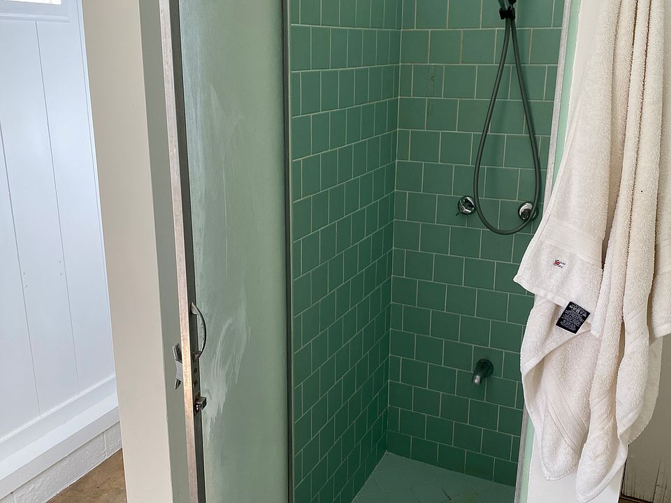 Bathroom shower, no tub.